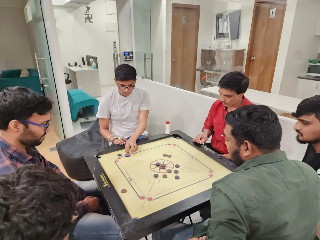 Playing carrom fun friday activities at upforcetech